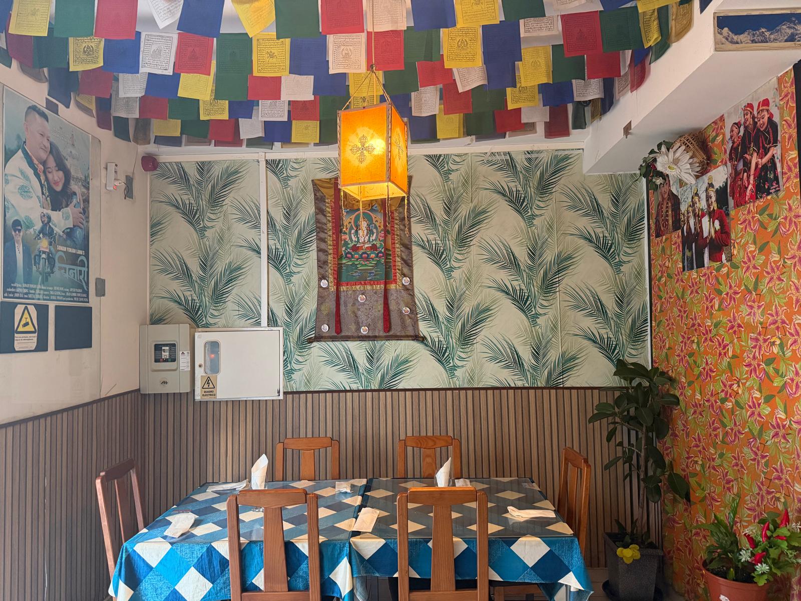 Prayer flags above the tables